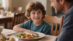 Un bambino in età scolare consuma una cena sana insieme a un genitore, seduto a un accogliente tavolo familiare. Nel piatto si trova una porzione di pesce